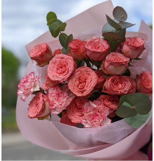 A mini compliment from a bush rose